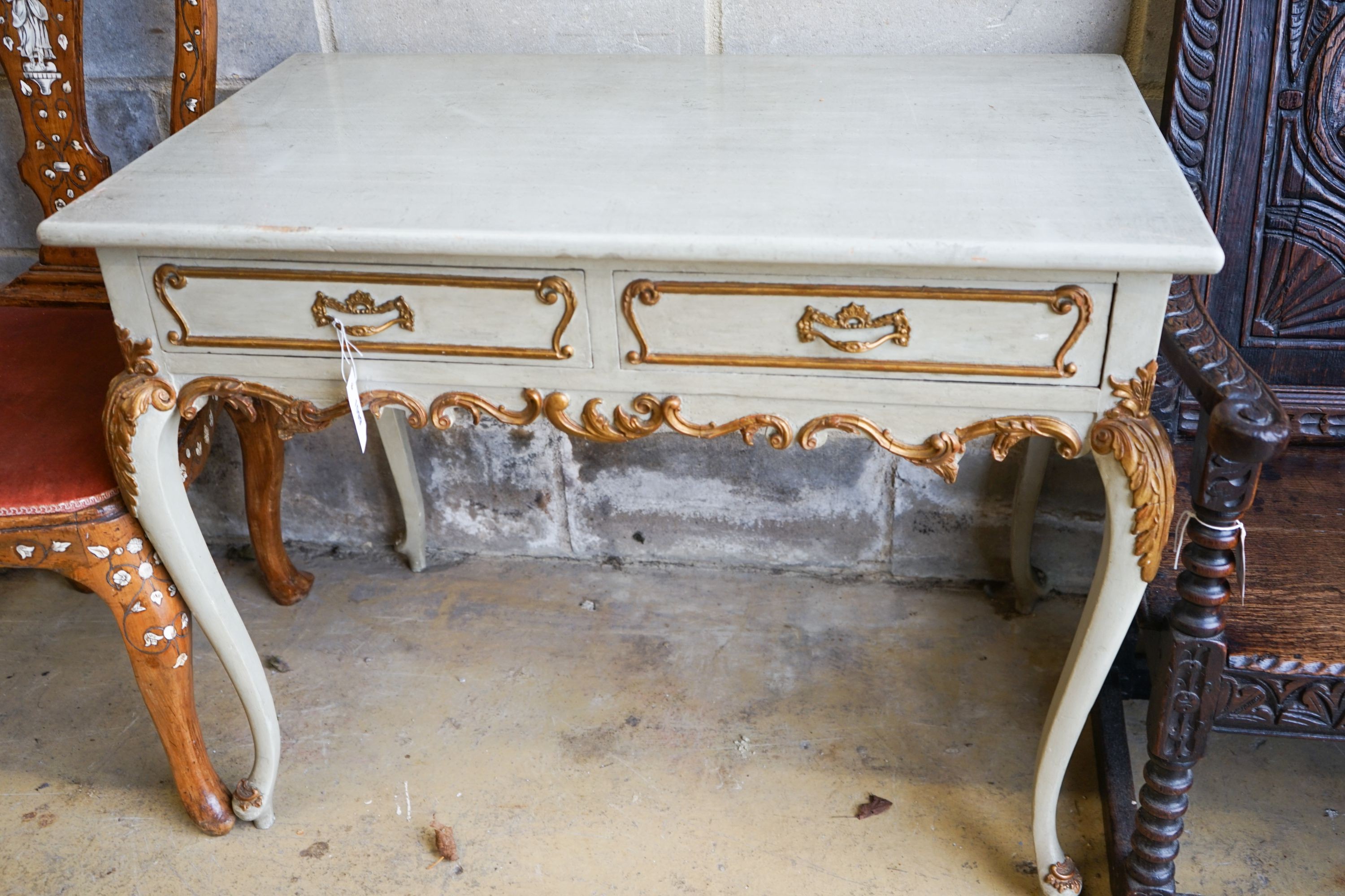 A late 19th century Italian painted and gilded two drawer side table, length 93cm, depth 53cm, height 73cm